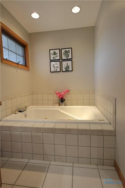 bathroom with tile patterned flooring, a garden tub, and recessed lighting