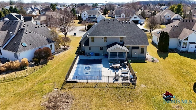 birds eye view of property with a residential view