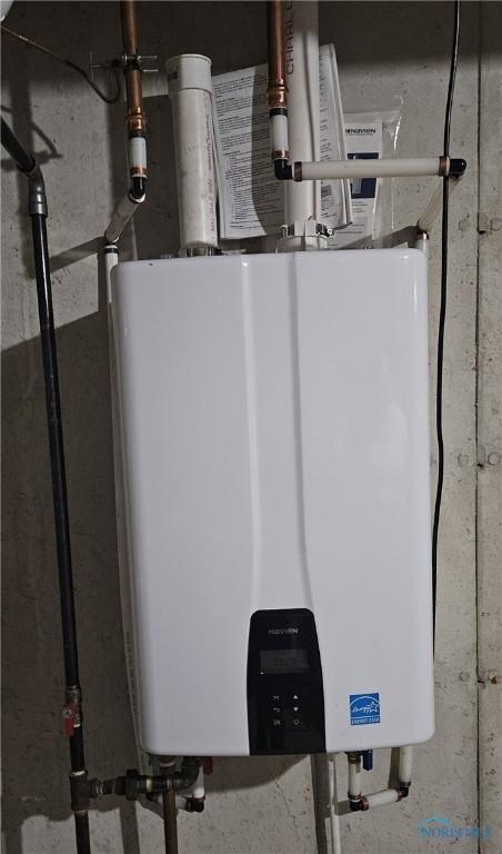 utility room with water heater