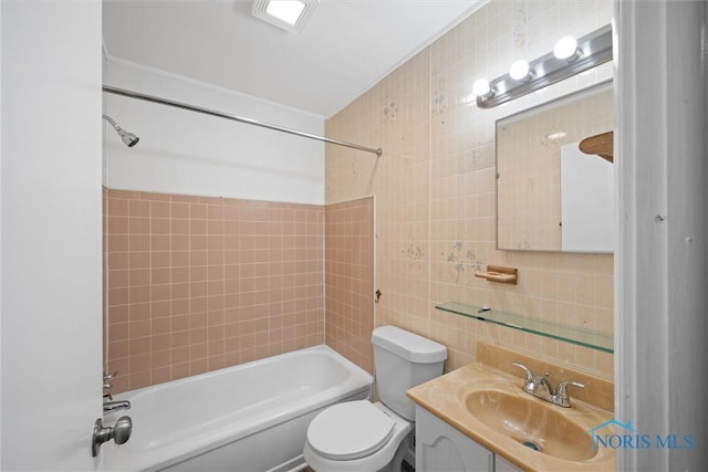 full bath with vanity, shower / bath combination, tile walls, toilet, and backsplash