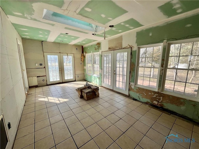 unfurnished sunroom featuring french doors