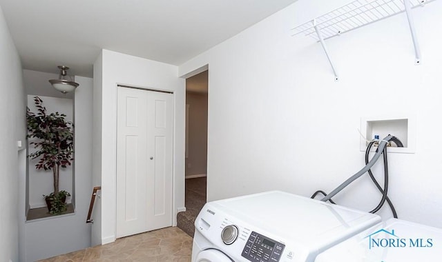 washroom featuring laundry area and washer and clothes dryer