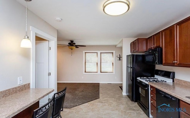 kitchen with baseboards, ceiling fan, hanging light fixtures, black appliances, and light countertops