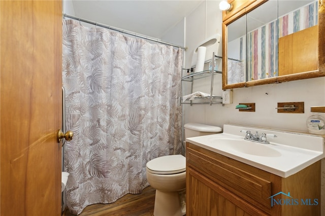 full bathroom with toilet, vanity, a shower with curtain, and wood finished floors