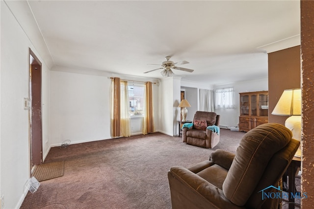 carpeted living room featuring baseboards and a ceiling fan