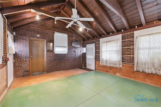 spare room featuring lofted ceiling with beams, brick wall, and wooden ceiling