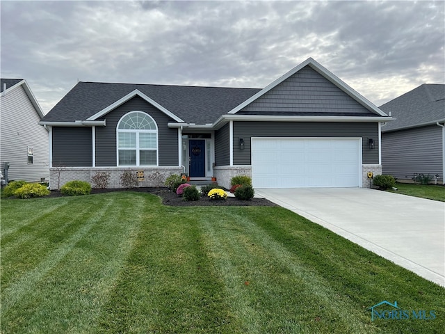 view of front of house featuring a garage, brick siding, concrete driveway, and a front yard