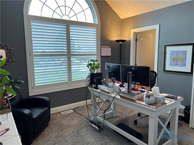 office featuring baseboards, lofted ceiling, and carpet