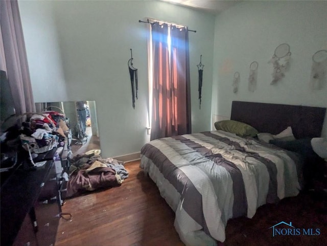 bedroom featuring wood finished floors