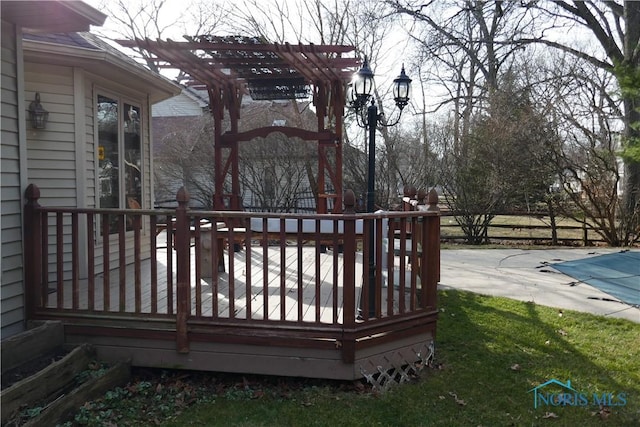 wooden terrace with a fenced in pool