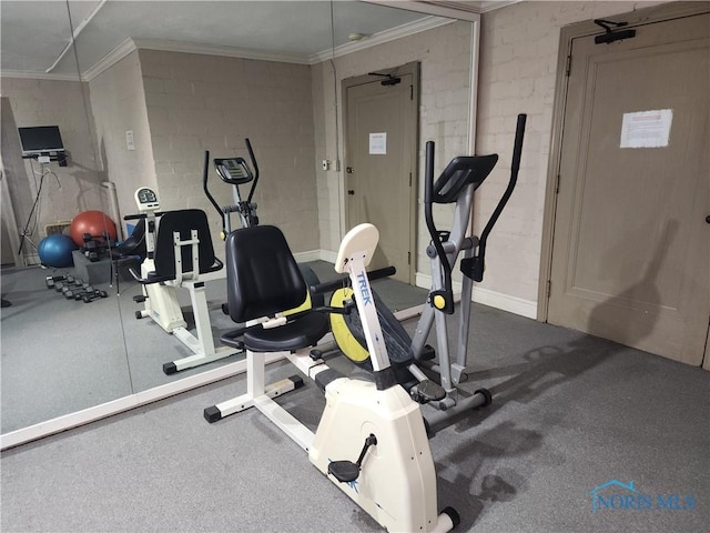 workout area with crown molding