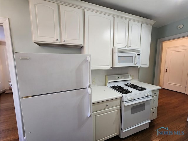 kitchen featuring white appliances, dark wood finished floors, light countertops, white cabinets, and tasteful backsplash