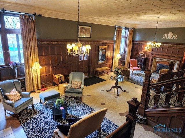 living area featuring a chandelier and ornamental molding