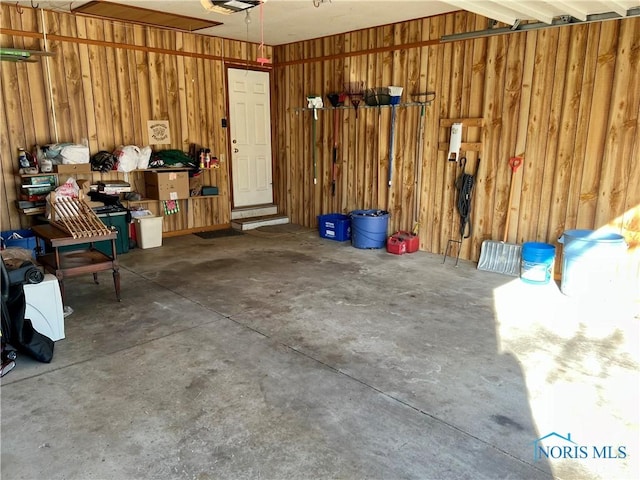 garage with wood walls