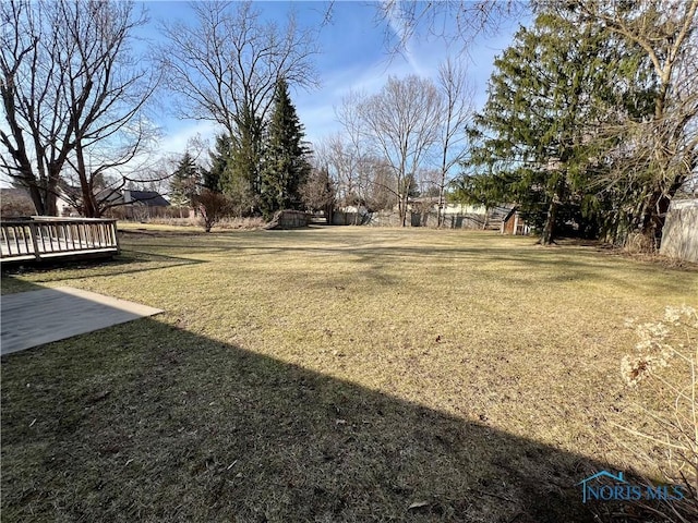 view of yard featuring a wooden deck