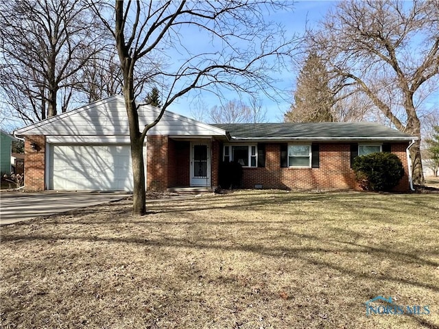 ranch-style home with a garage, a front yard, brick siding, and driveway