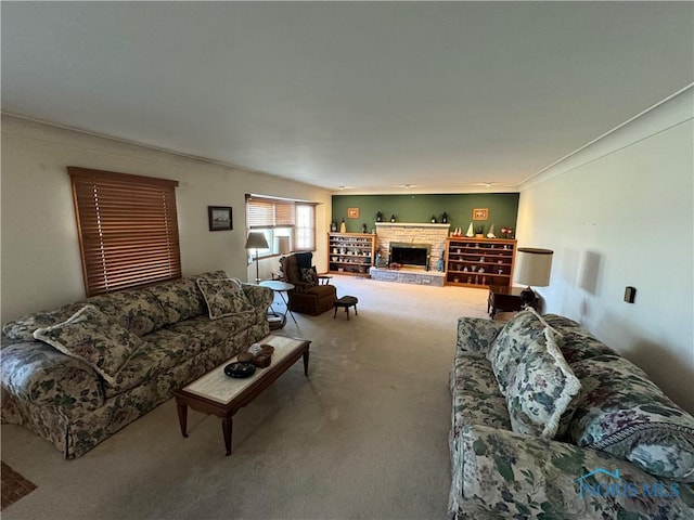 carpeted living area with a fireplace