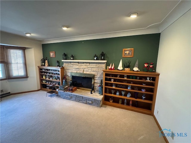 carpeted living room with baseboards and a fireplace