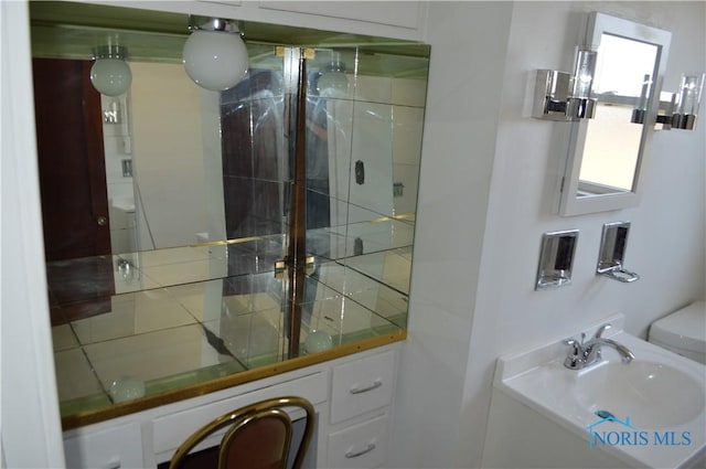 full bath featuring a sink and a shower stall