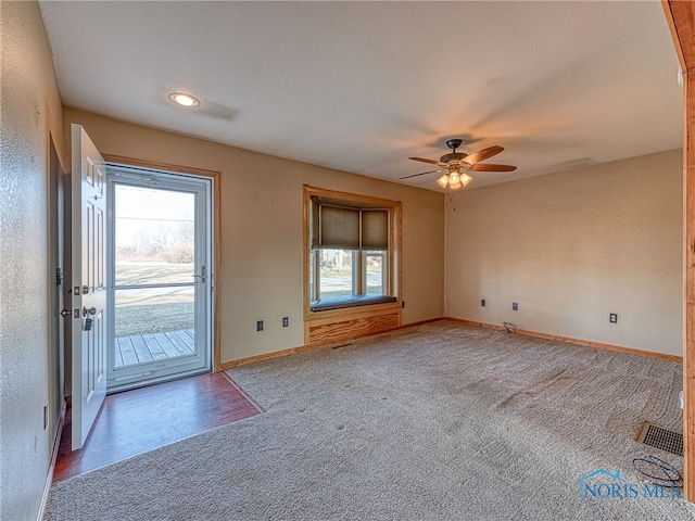 interior space featuring a ceiling fan and baseboards