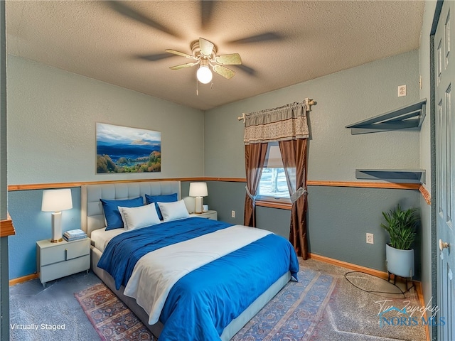 bedroom with carpet, a textured wall, baseboards, and a textured ceiling