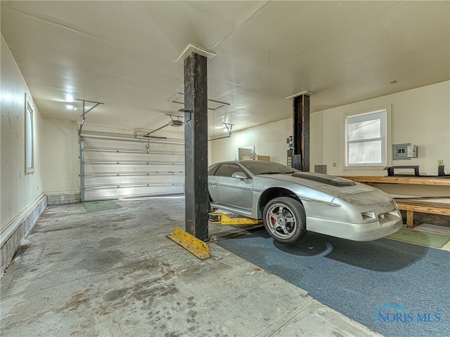 parking garage featuring a garage door opener