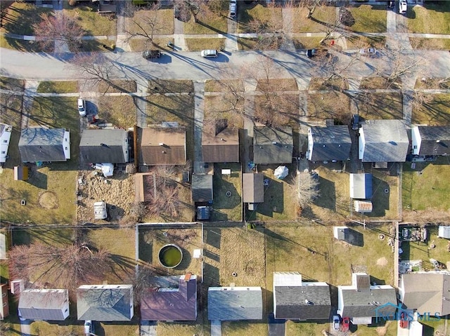 birds eye view of property with a residential view