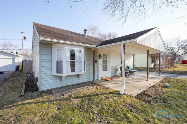 rear view of house featuring a patio