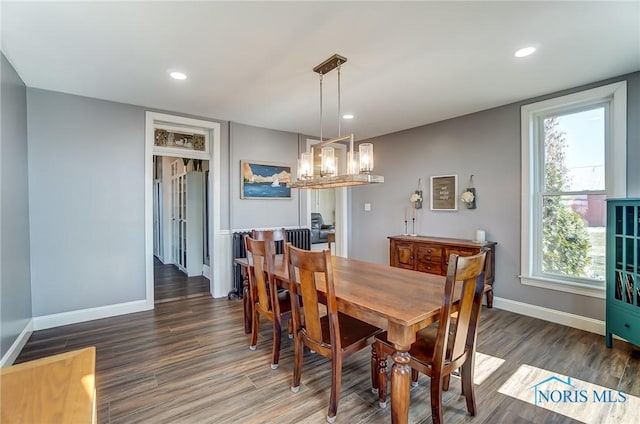 dining room with recessed lighting, wood finished floors, and baseboards