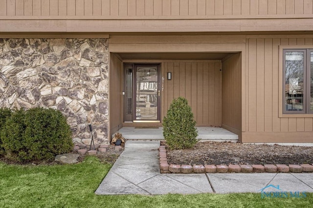 view of exterior entry with stone siding