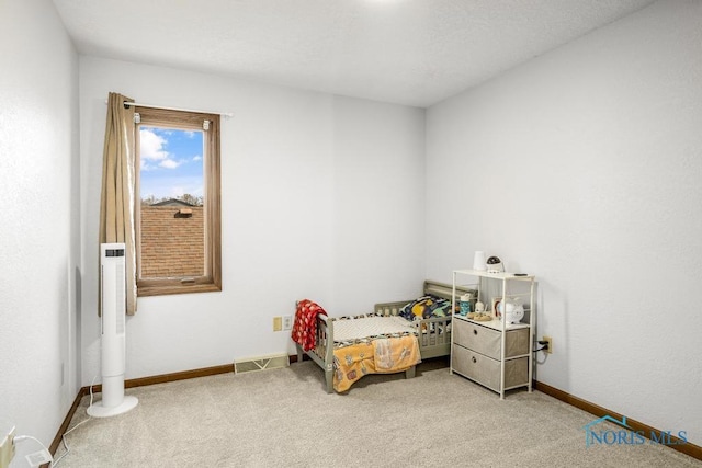 bedroom with visible vents, baseboards, and carpet floors