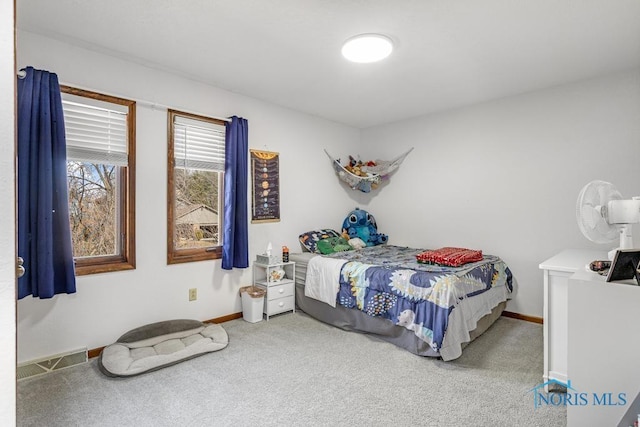 bedroom with baseboards, carpet floors, and visible vents