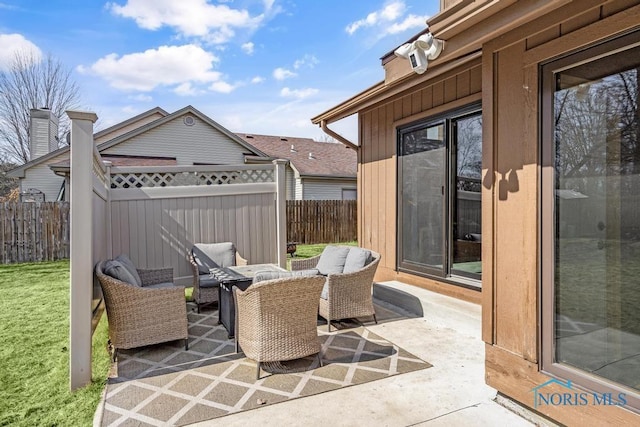 view of patio / terrace featuring fence