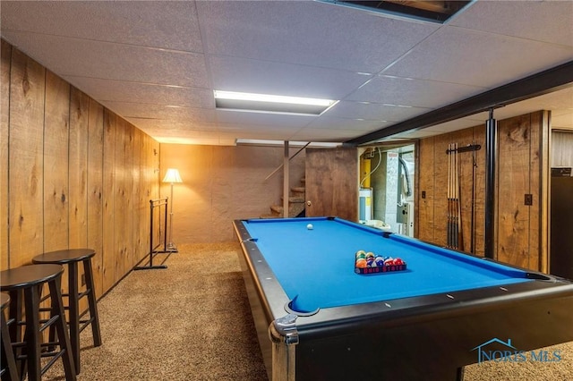 playroom with wooden walls, a paneled ceiling, water heater, carpet flooring, and billiards