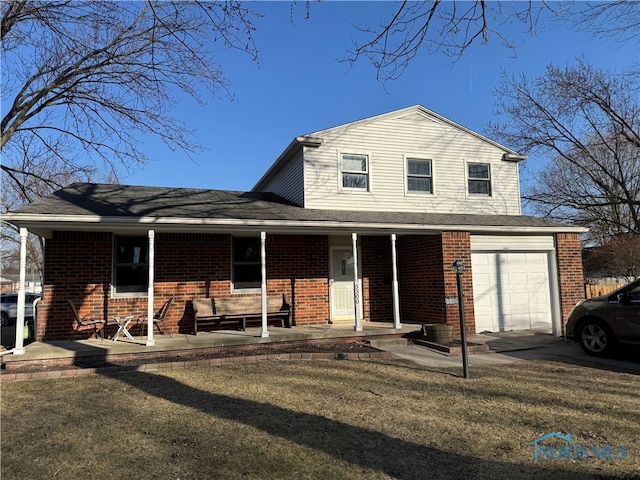 traditional home with a porch, brick siding, and a front lawn