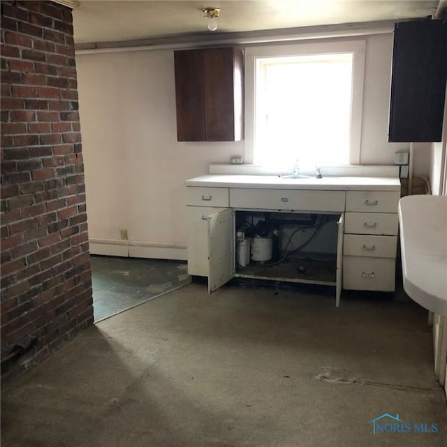 kitchen featuring light countertops and carpet flooring