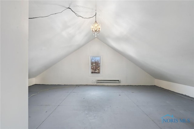 bonus room with a baseboard heating unit, lofted ceiling, and a chandelier