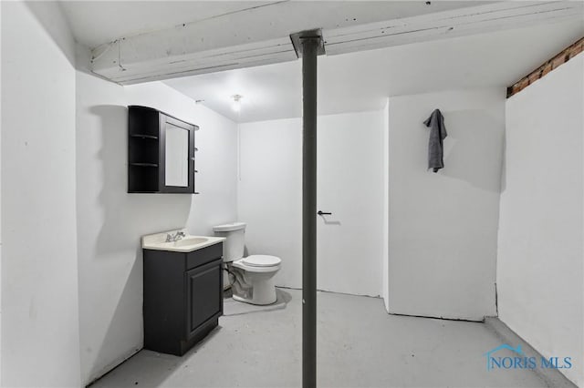 half bathroom featuring vanity, toilet, and concrete floors