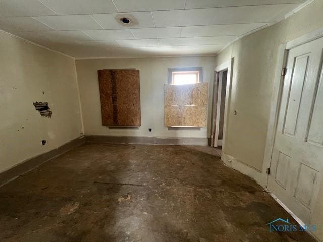 empty room featuring baseboards