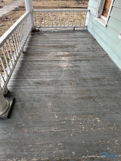 wooden deck featuring covered porch