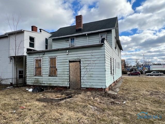 rear view of house with a chimney