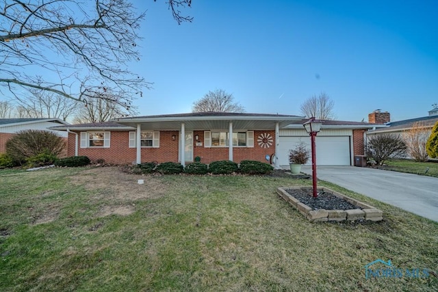 ranch-style home with concrete driveway, a garage, brick siding, and a front lawn