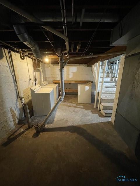 basement with washer and clothes dryer