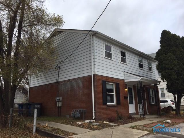 view of home's exterior with brick siding