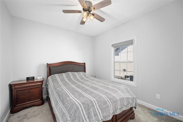 bedroom featuring carpet flooring, baseboards, and ceiling fan