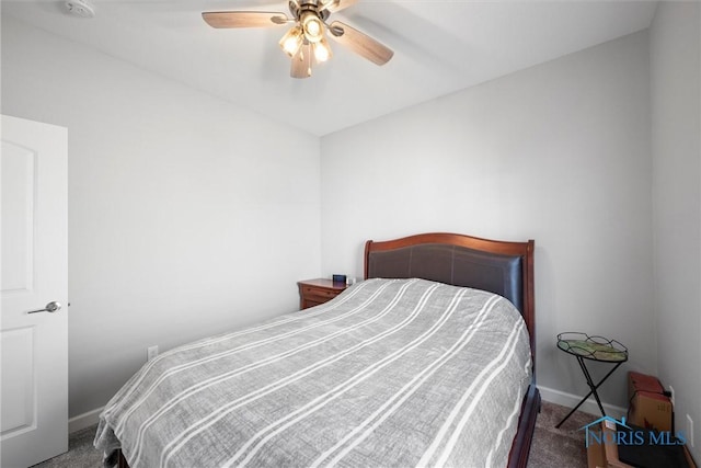 carpeted bedroom featuring baseboards and ceiling fan