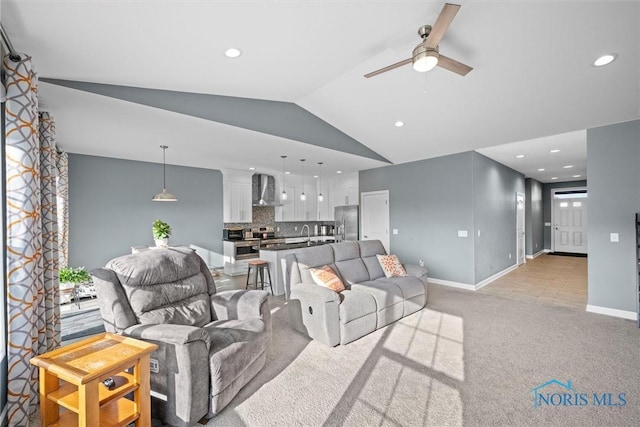 living area featuring light carpet, lofted ceiling, recessed lighting, baseboards, and ceiling fan