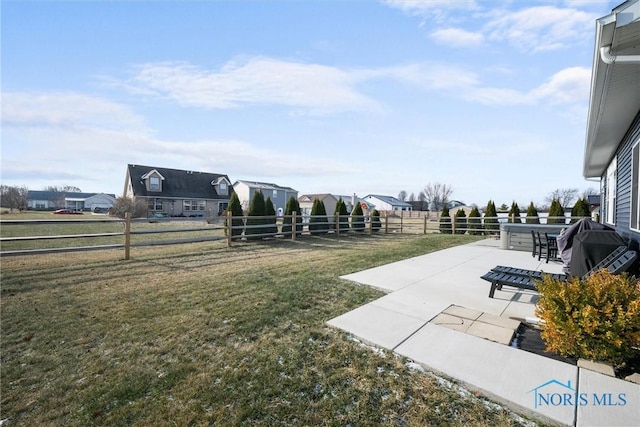 view of yard featuring a patio area and fence