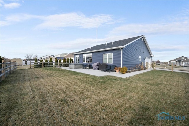 rear view of property with a yard, a fenced backyard, and a patio area