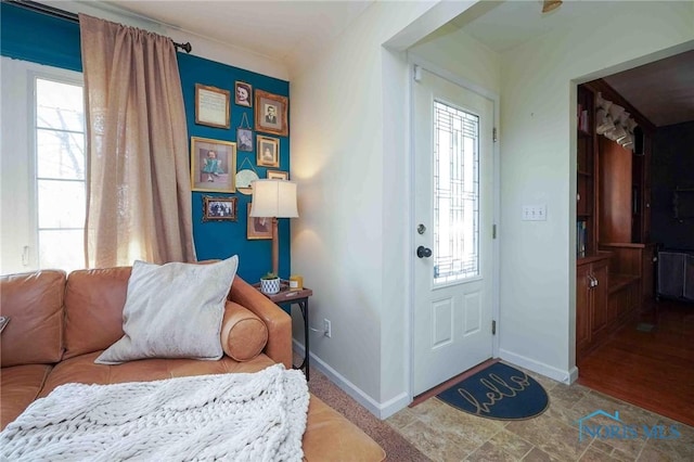 entryway featuring baseboards